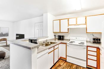 Kitchen breakfast bar with view into living area